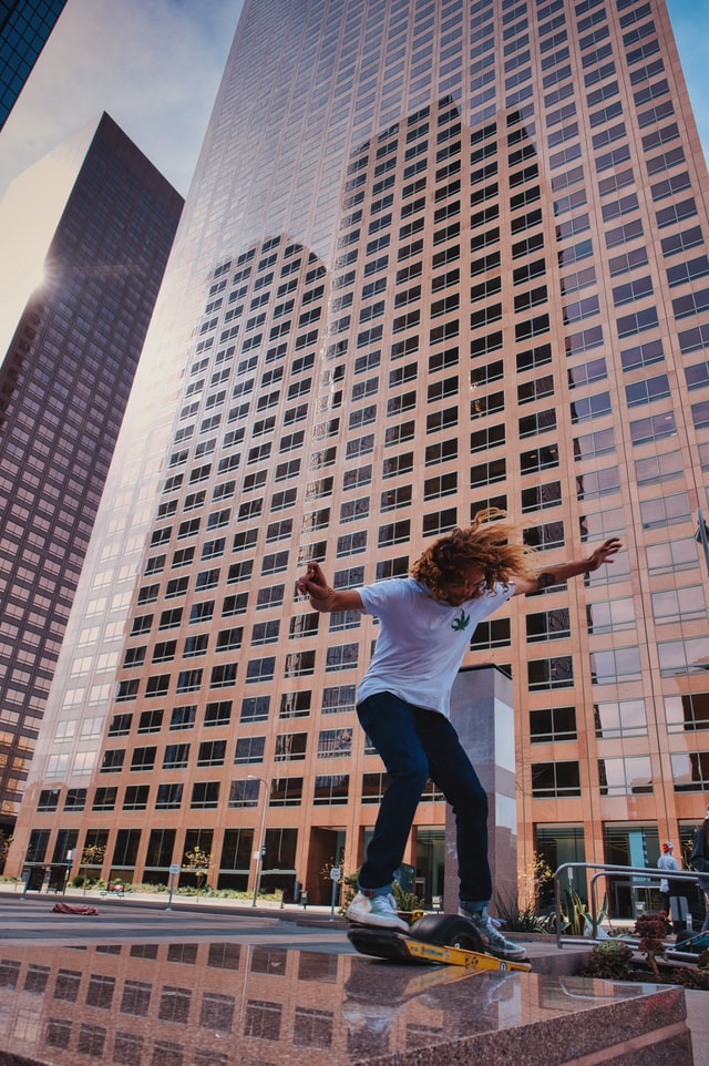 guy infront of building with onewheel